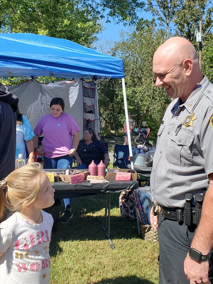 Wright County Sheriff Sonny Byerely shares a smile with Pyper Stout.