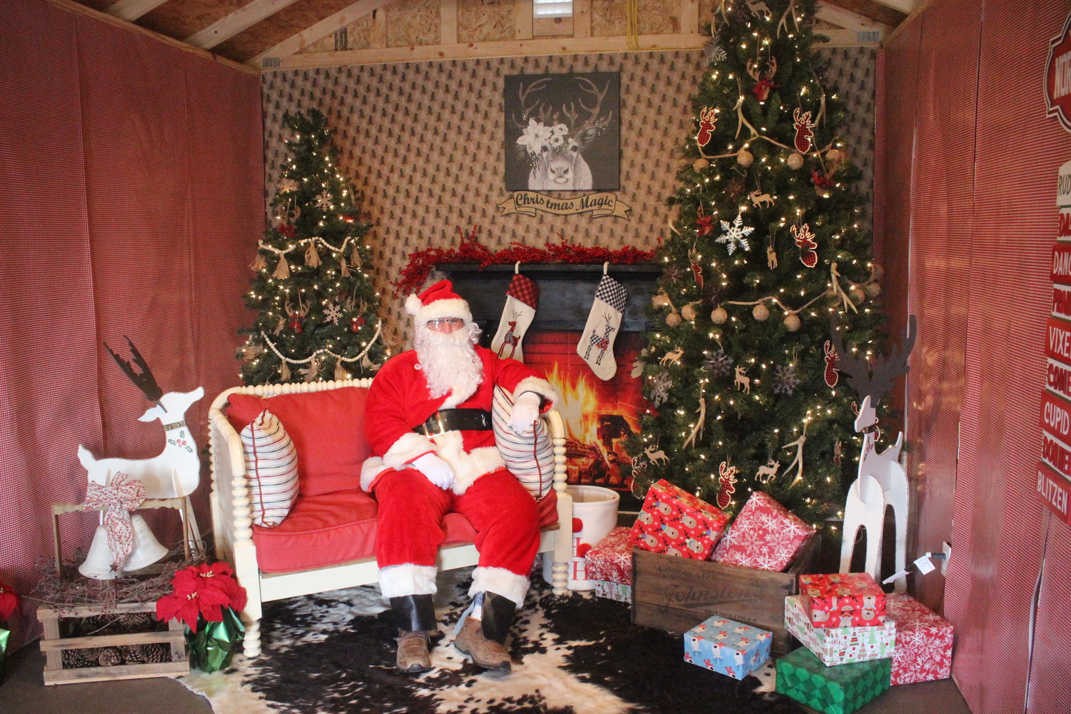 Santa Claus is ready for visitors at Holly Jolly Reindeer Ranch.